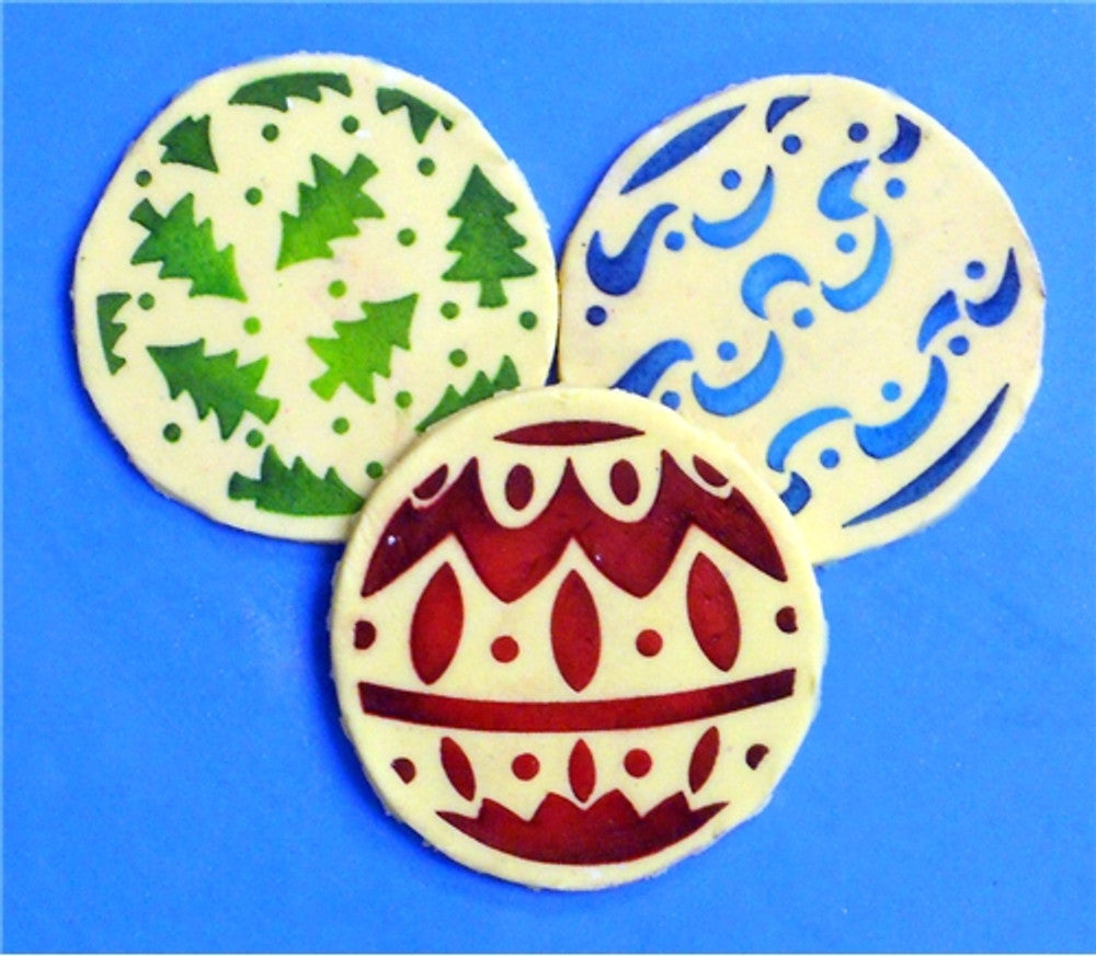 Round cookies decorated using the Christmas Balls Round Cookie Stencil Set by Designer Stencils