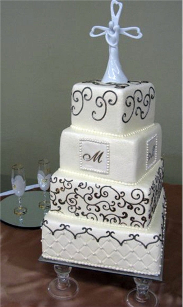 Leafy Scroll Cake Stencil Side by Designer Stencils applied to a white wedding cake