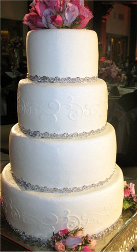 Leafy Scroll Cake Stencil Side by Designer Stencils applied to a wedding cake
