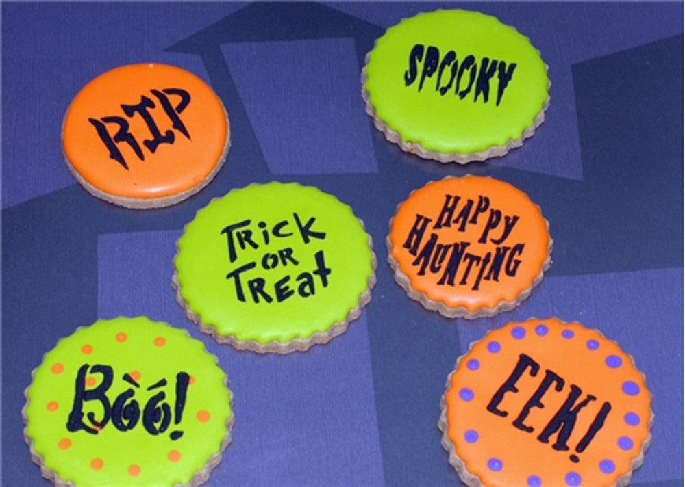Colorful Halloween cookies with sayings like 'RIP', 'Boo!', 'Spooky', and 'Trick or Treat', perfect for festive decoration.