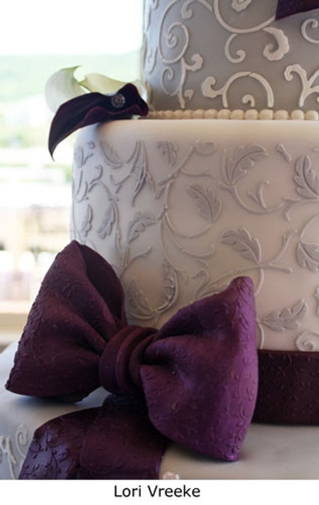 Leafy Scroll Cake Stencil Side by Designer Stencils applied to a cake