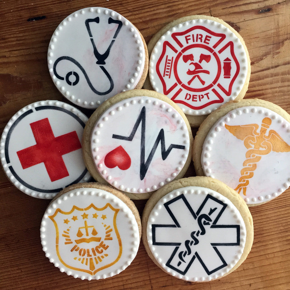 Decorative cookies featuring medical and emergency symbols, perfect for celebrations or themed events.