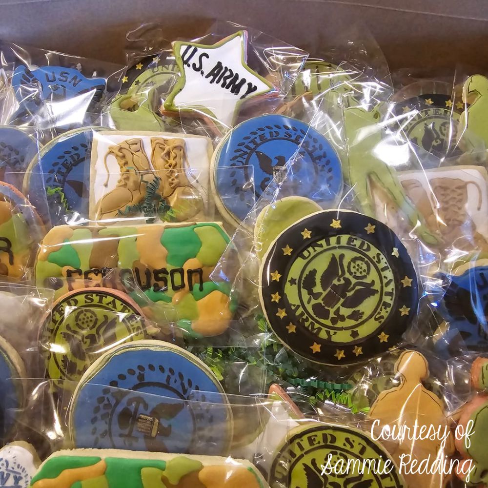 Colorful decorated cookies featuring US Army, Navy, and Military designs, ideal for themed events and celebrations.