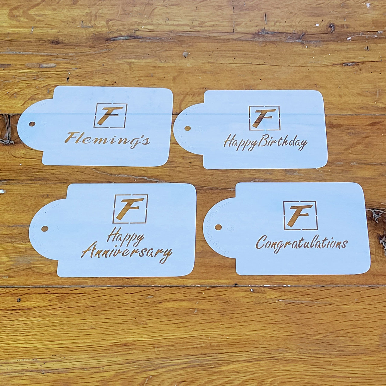 Set of 4 stencils featuring Flemings logo: Happy Birthday, Happy Anniversary, and Congratulations.
