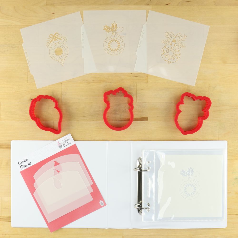 Vintage glass ornament project box with stencils and cookie cutters for holiday baking.