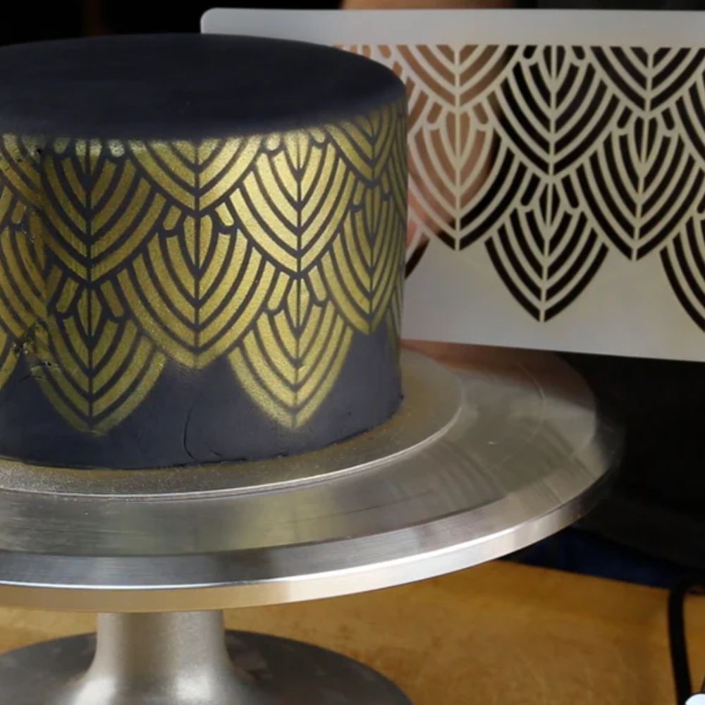 Stenciling a fondant covered cake with gold