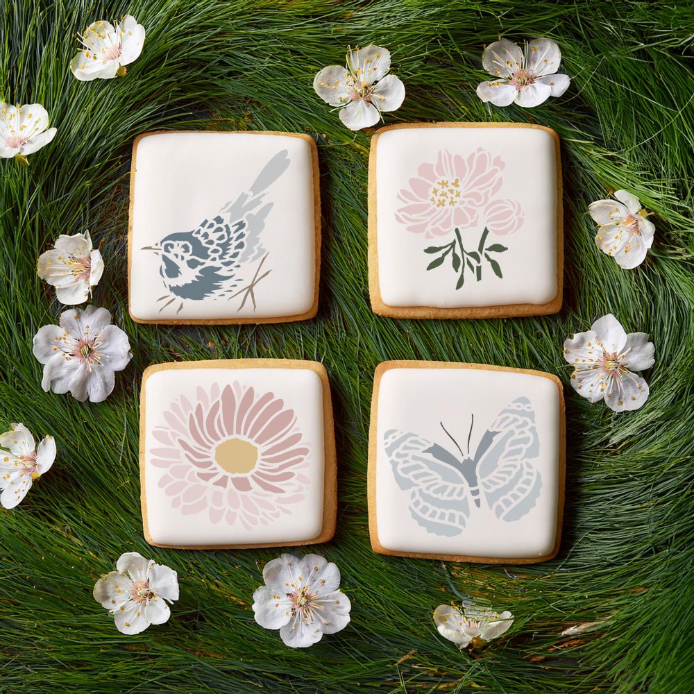 Spring Designs Cookie Stencil applied to white iced cookies