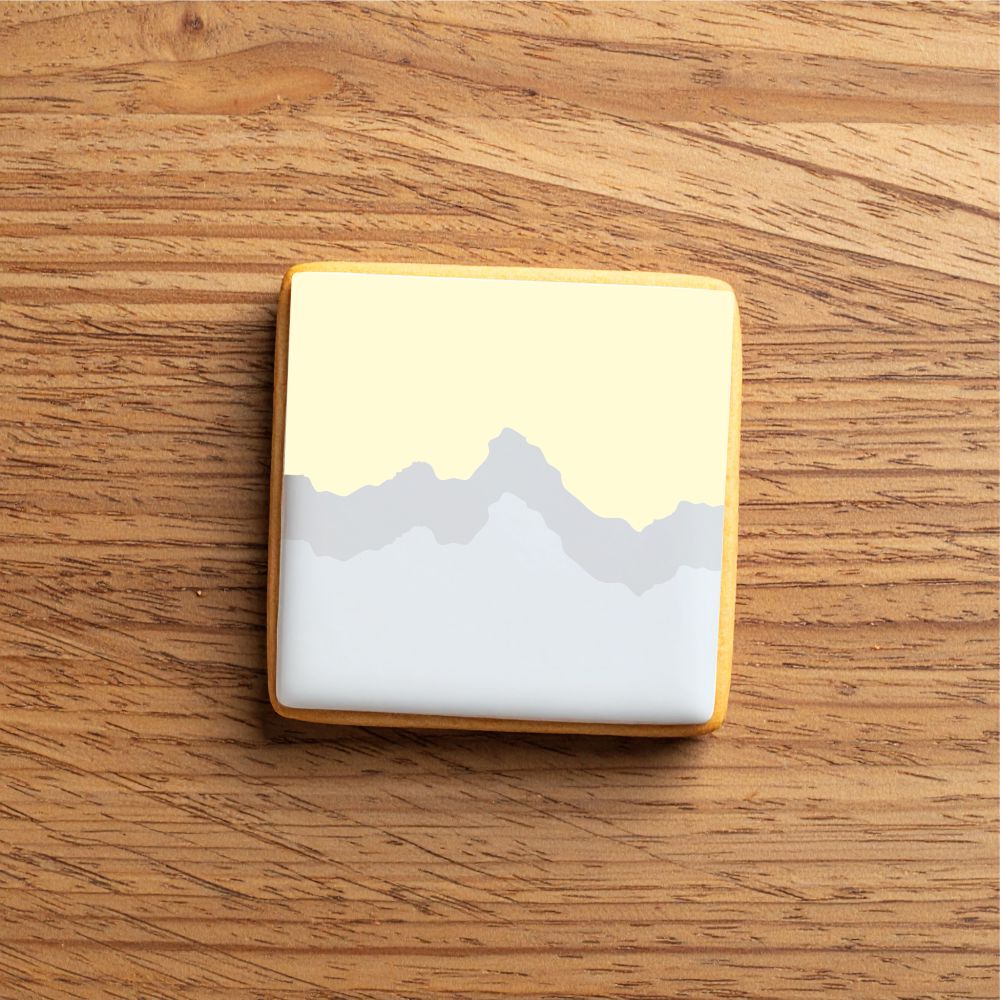 Cookie decorated using the Mountain Range Cookie Stencil Edger