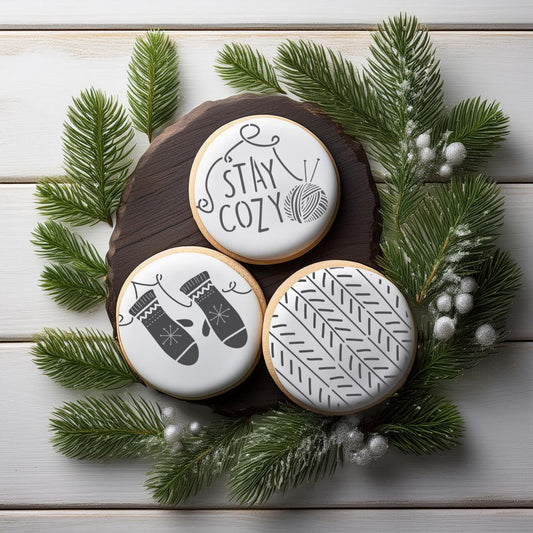 3 round cookies decorated using the Nordic Lodge Cookie Stencil Set