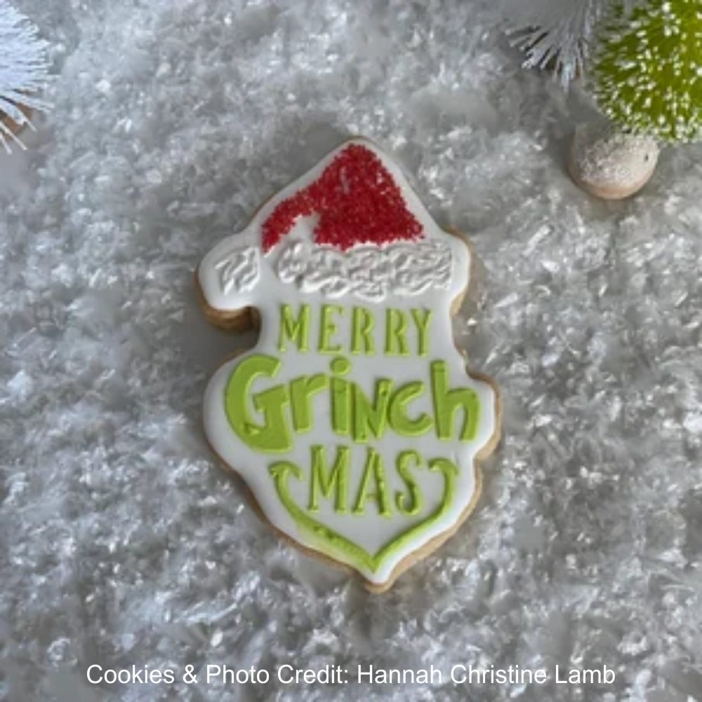 GRINCH COOKIES BY HANNAH LAMB USING ROYAL ICING AND MERRY GRINCH MAS COOKIE STENCIL
