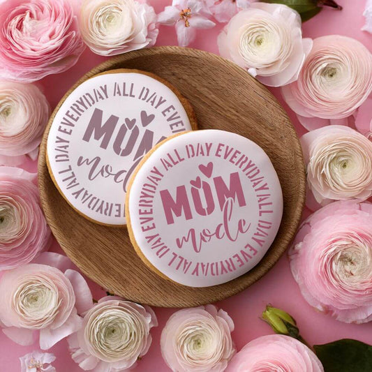 Mom Mode Cookie Stencil applied to round cookies for Mother's Day