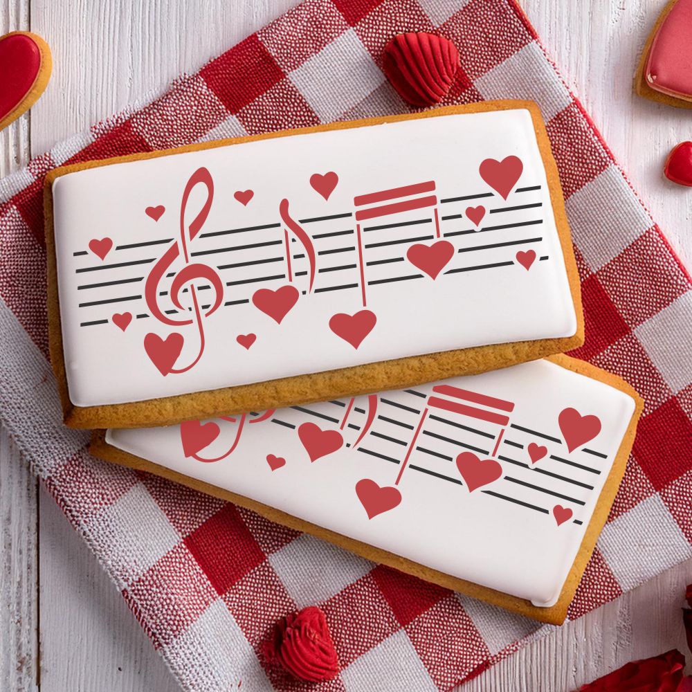 Musical themed cookies decorated with sheet music and hearts, perfect for Valentine's Day treats.