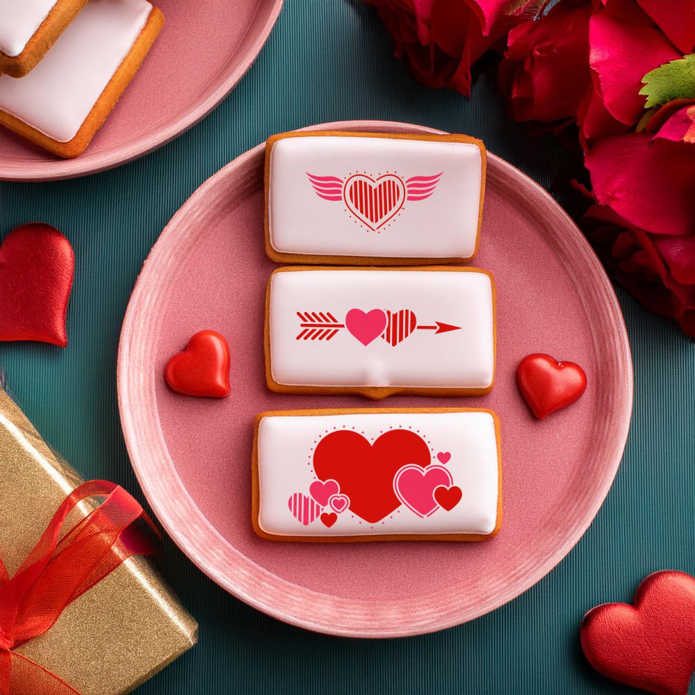 Valentine Hearts Cookie Stencil Set featuring decorated cookies with heart designs on a pink plate for Valentine's Day.