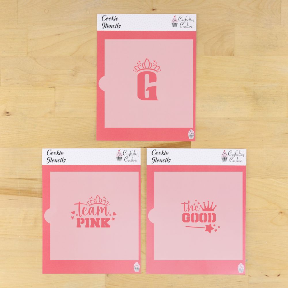 Team Pink Cookie Stencil Set featuring 'G', 'team PINK', and 'the GOOD' designs on pink stencils for festive cookie decorating.