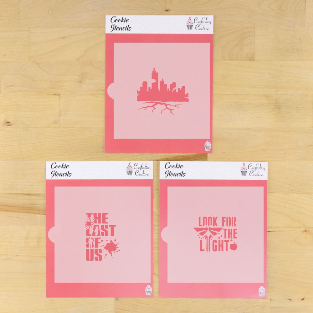 Set of The Last of Us cookie stencils in their packaging laying on a wooden surface.
