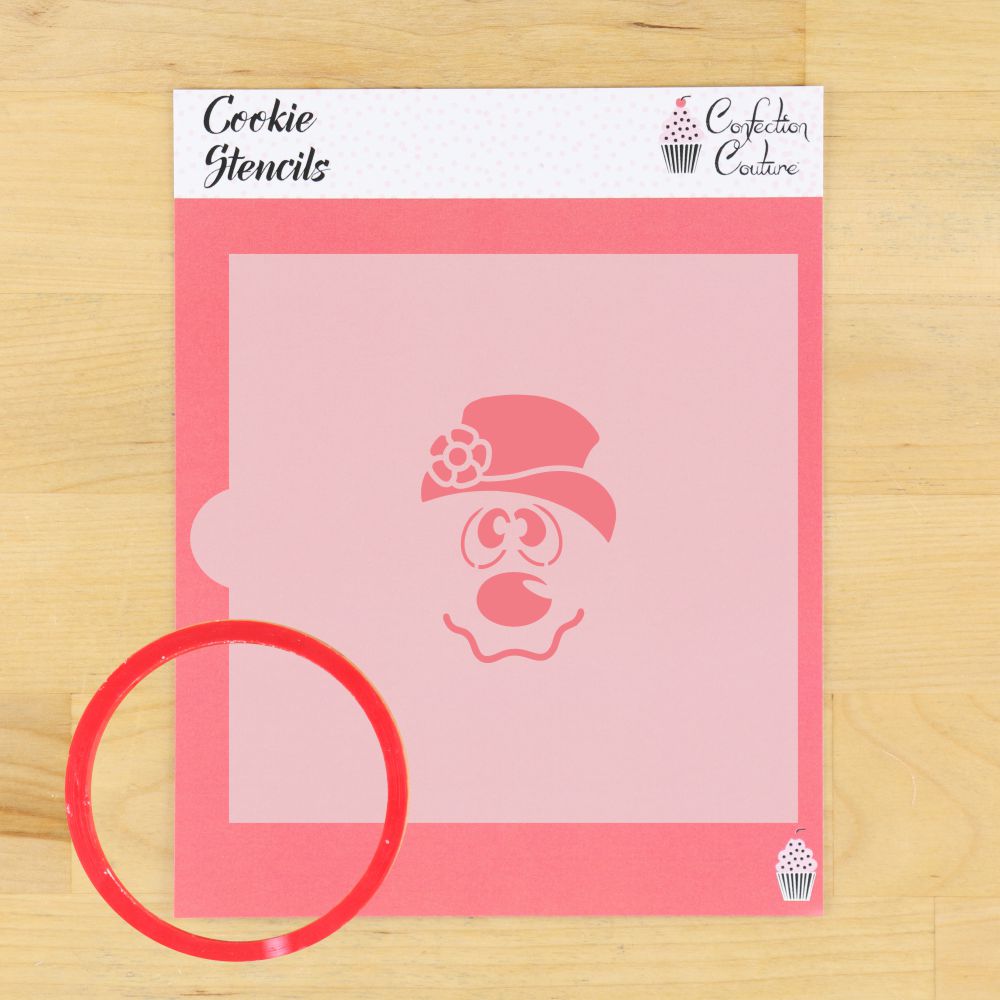 Frosty Snowman cookie stencil on pink background with round red cutter, perfect for festive cookie decorating.