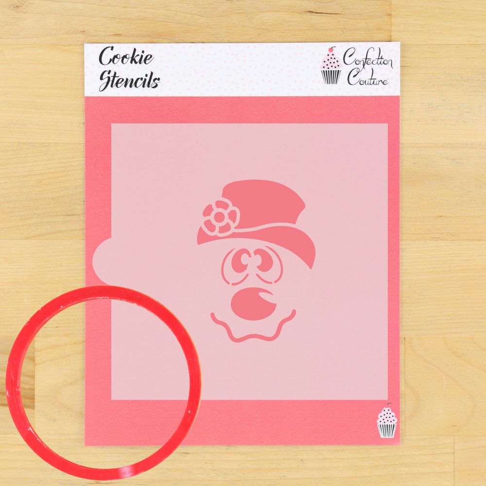 Frosty Snowman cookie stencil on a pink background with a round cookie cutter, perfect for festive cookie decorating.