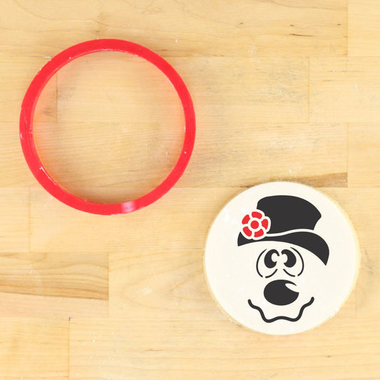 Frosty Snowman Cookie Stencil on a round cookie with a red cutter, perfect for festive holiday decorating.