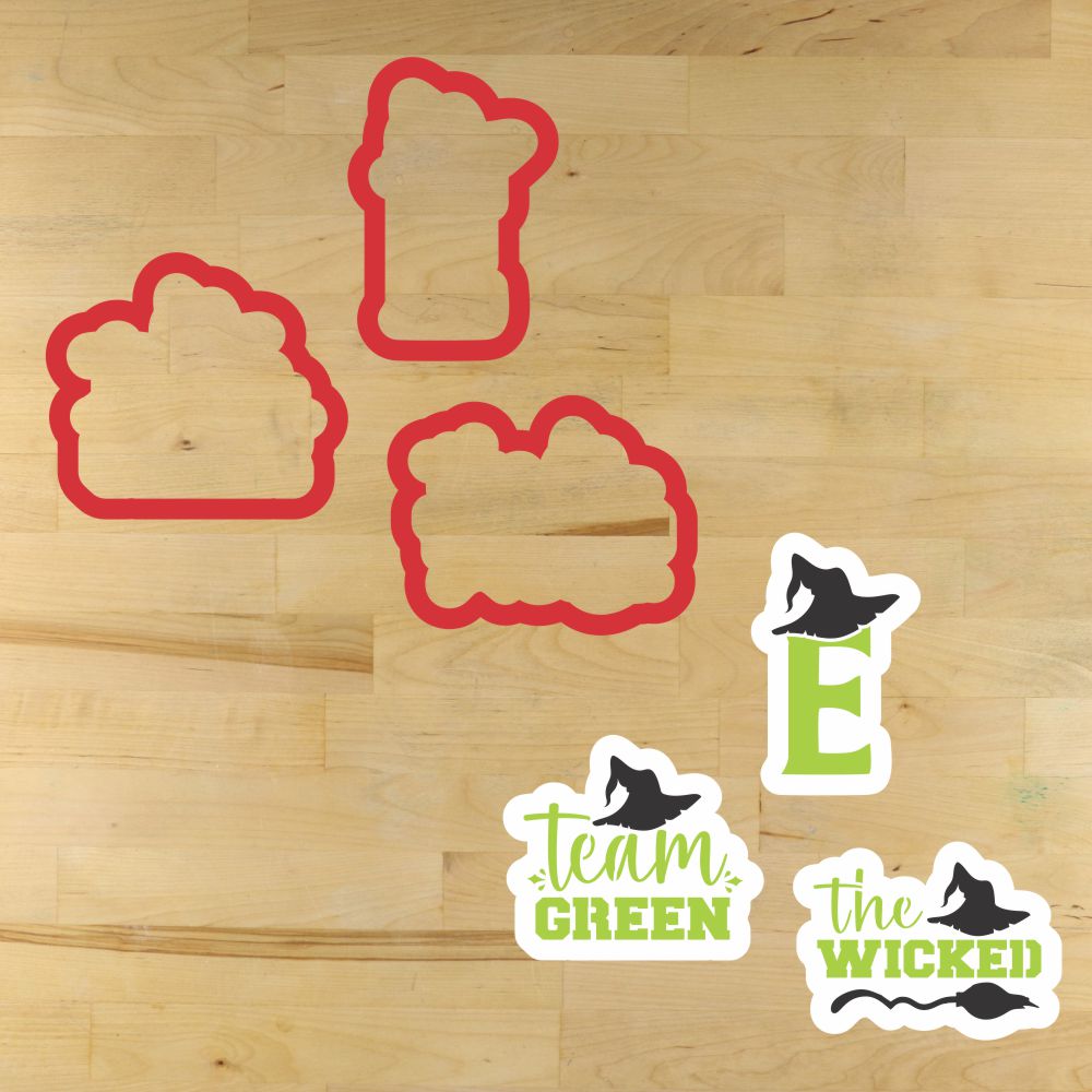 Team Green Cookie Stencil Set featuring red cookie shapes and themed designs on a wooden surface.