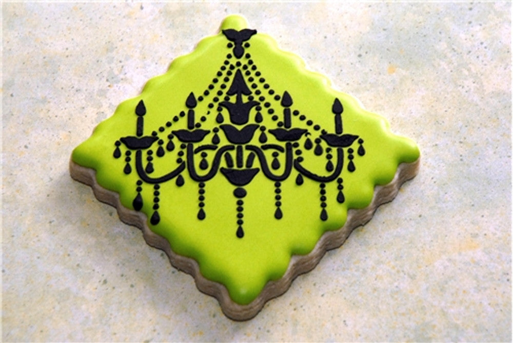 Chandelier Cake Stencil Side Set by Designer Stencils iced onto neon yellow cookies