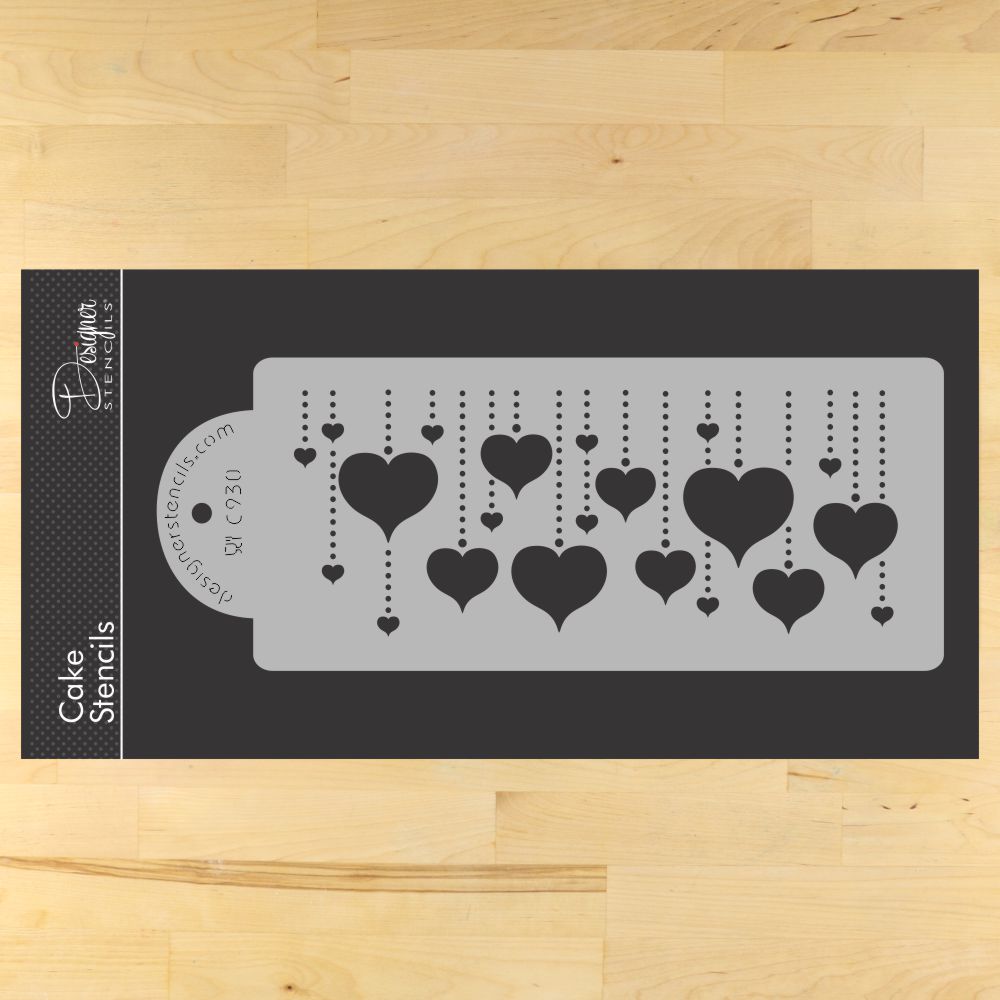 Designer Stencils Hanging Hearts Cake Stencil in beige, perfect for decorating cakes with heart designs.