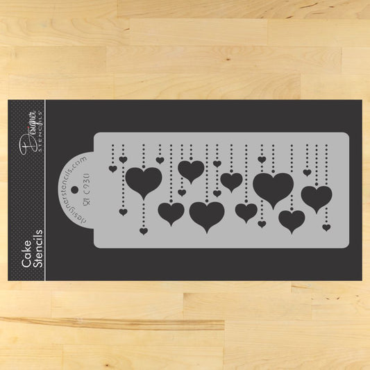 Designer Stencils Hanging Hearts Cake Stencil in beige, perfect for decorating cakes with heart designs.