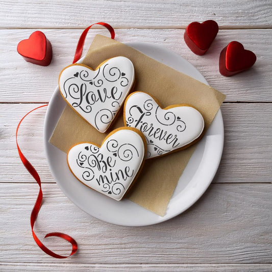 Heart cookies decorated using Love Be Mine Forever Heart Shaped Cookie Stencil Set by Designer Stencils