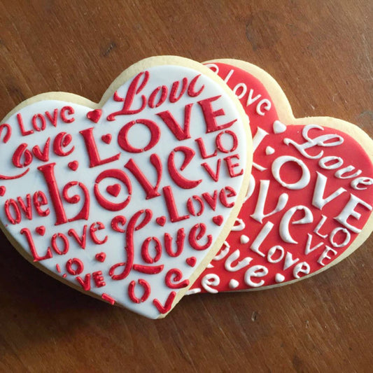 Heart cookies decorated using Love Saying Cookie Stencil by Designer Stencils