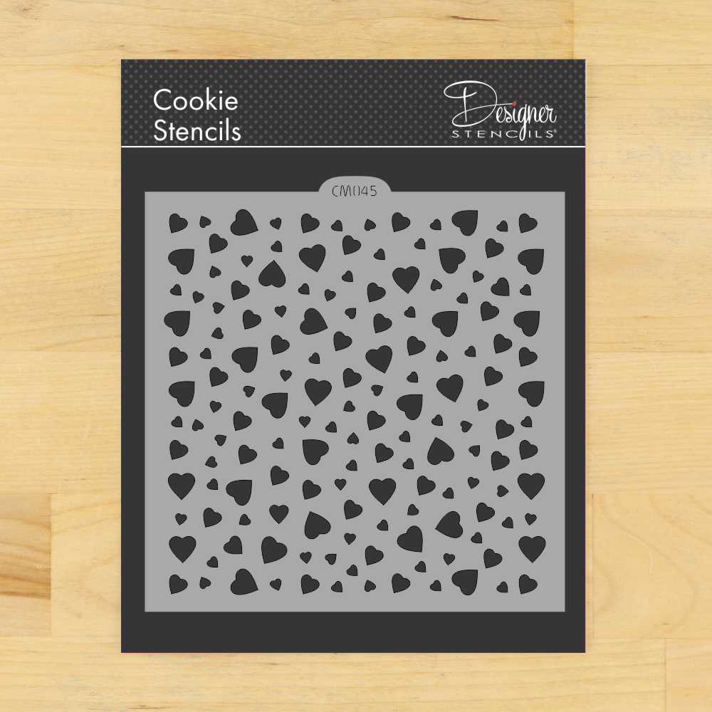 Mini heart cookie stencil by Designer Stencils, featuring multiple heart shapes for decorating cookies and crafts.