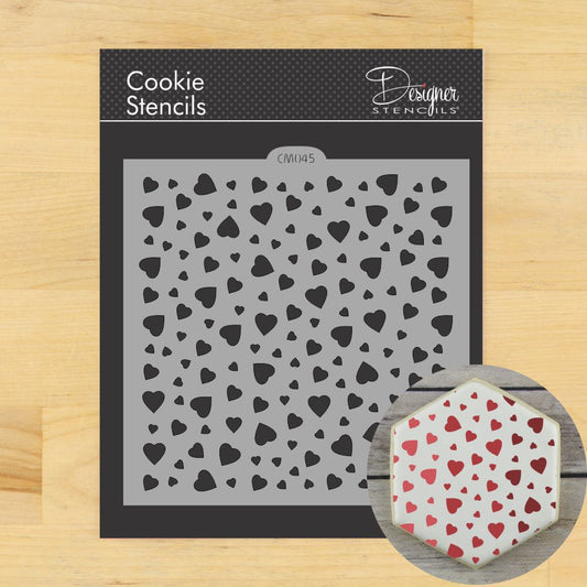 Mini Heart Cookie Stencil by Designer Stencils, featuring a pattern of small hearts for cake and cookie decoration.