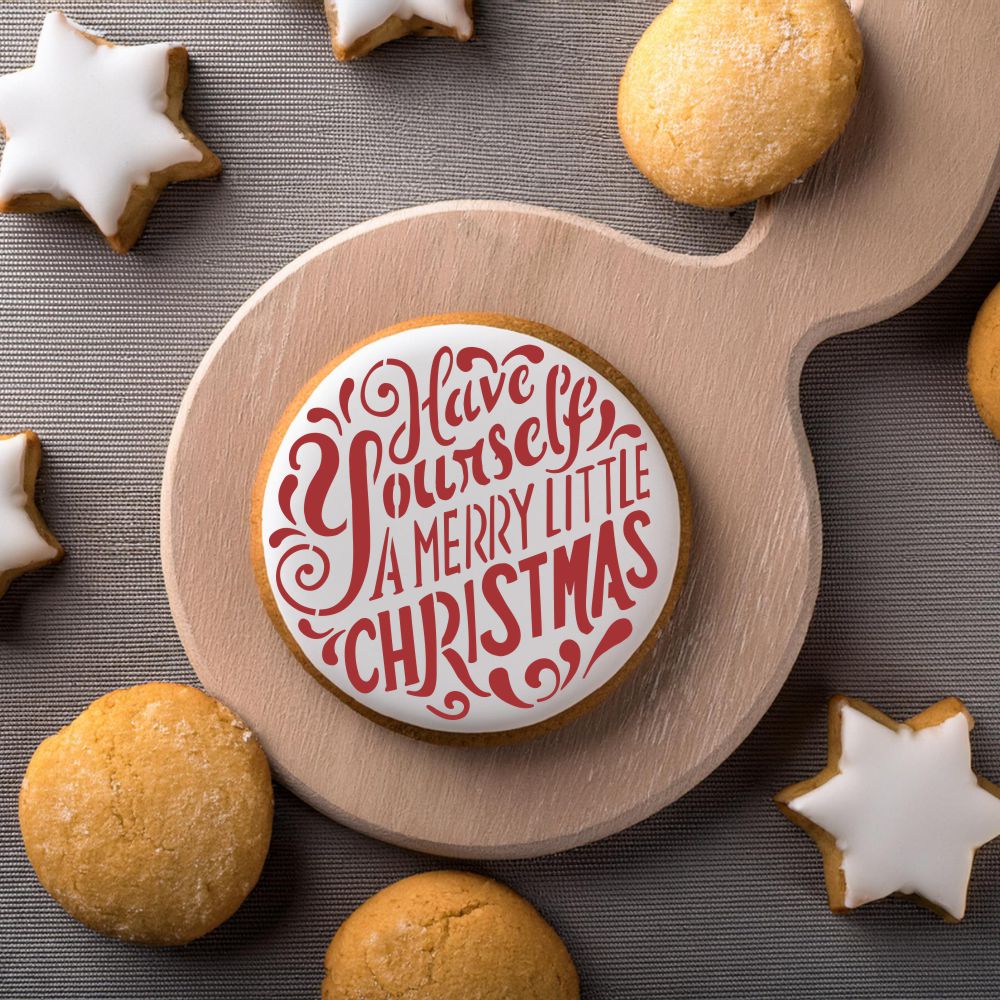 Round Cookie decorated with the Merry Little Christmas Ornament Cookie Stencil