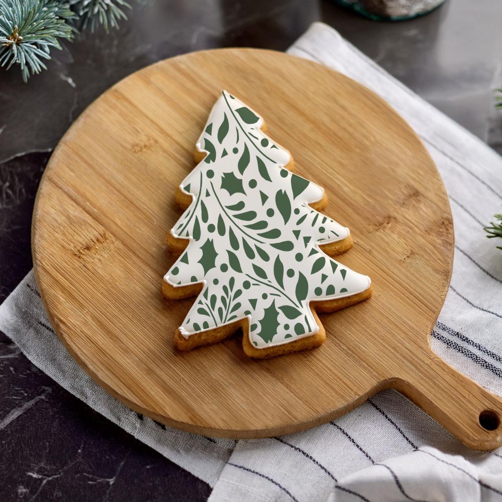 Tree Shaped Cookie Decorated Using the Winter Greenery Cookie Stencil