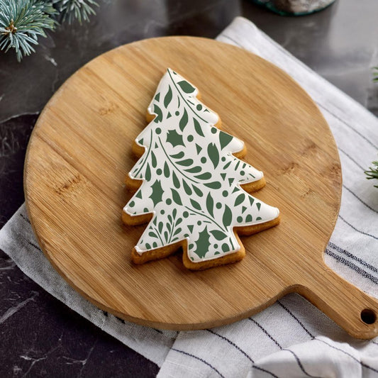 Tree Shaped Cookie Decorated Using the Winter Greenery Cookie Stencil