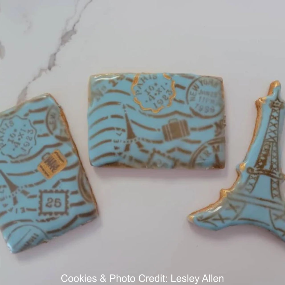 Bon Voyage Background Cookie Stencil Airbrushed onto a cookie by Lesley Allen