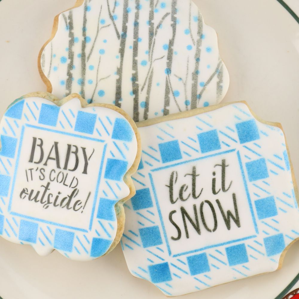 Baby it's cold outside message airbrushed on cookies