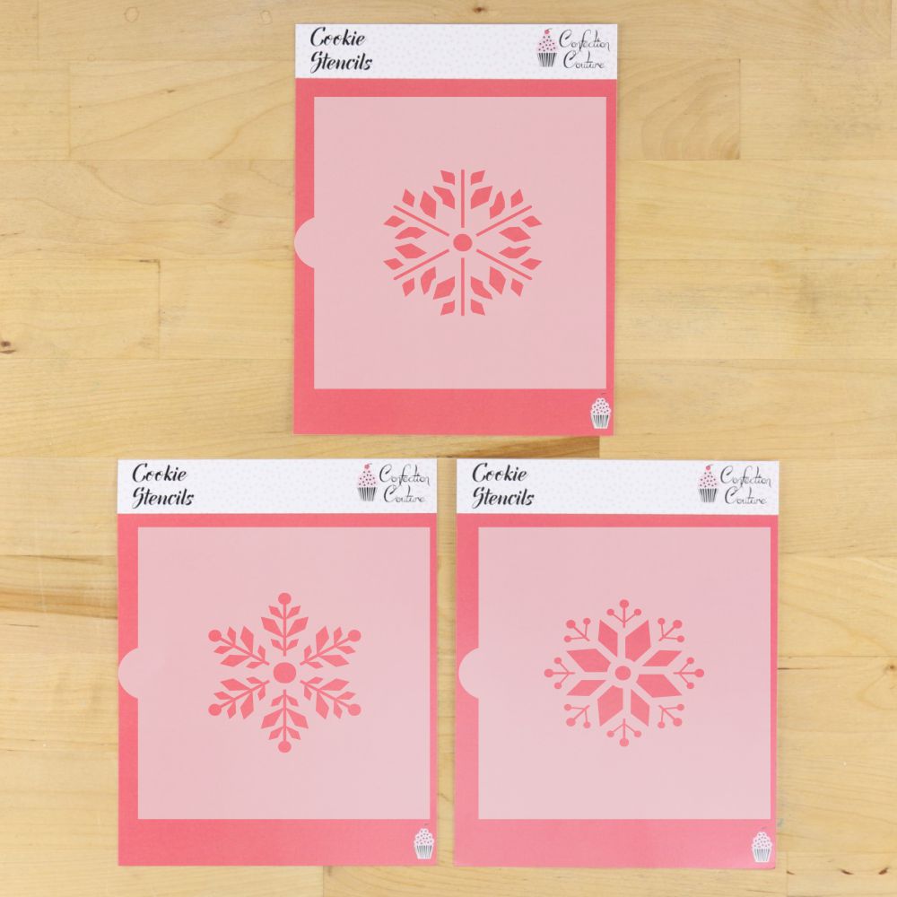 Set of three pink cookie stencils featuring snowflake designs for holiday baking and decorating projects.