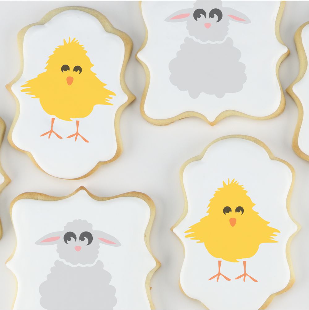 Easter cookies decorated with royal icing and airbrushed lambs and chics
