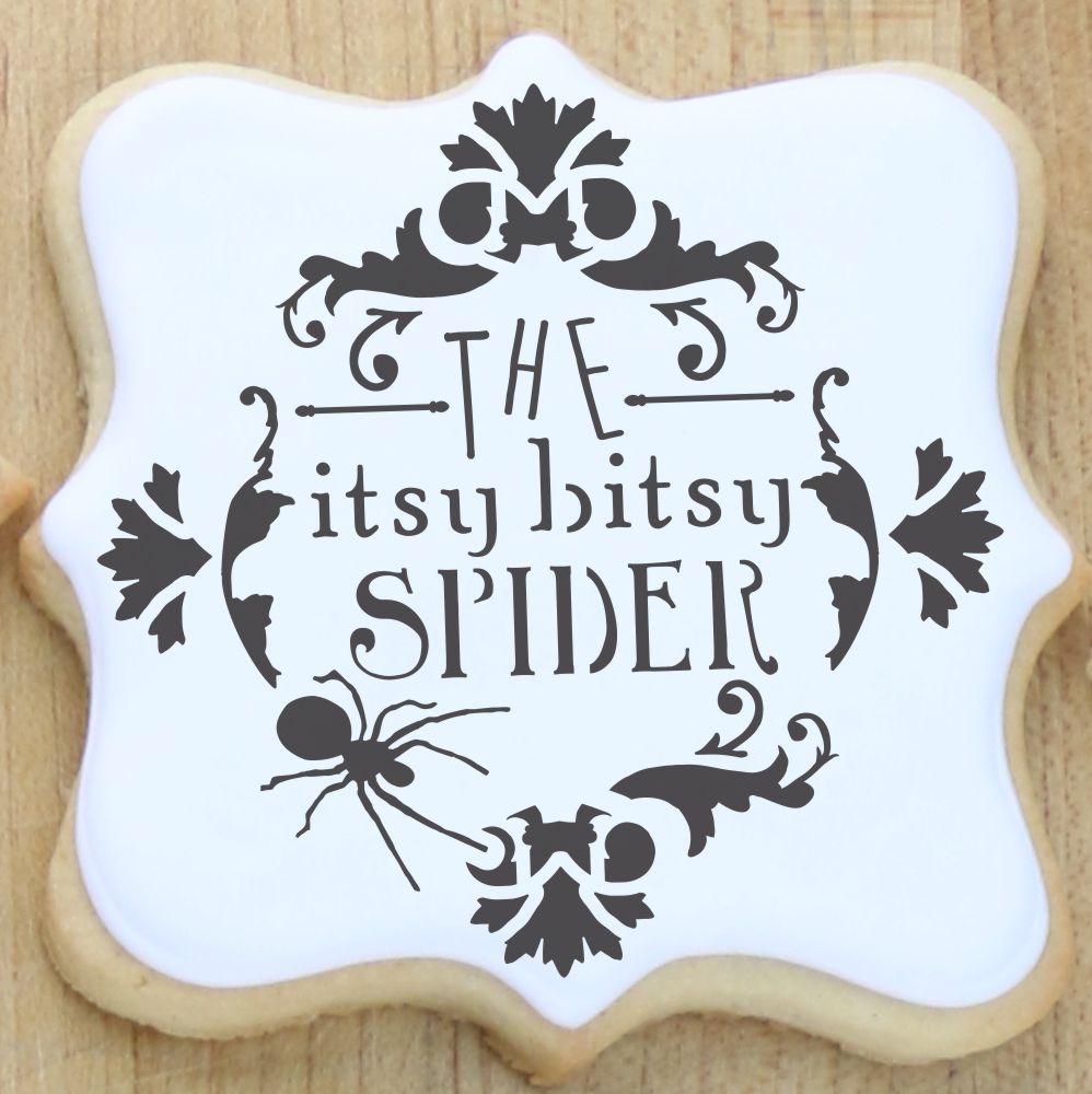 Halloween Stencil itsy bitsy spider cookie stencil message on iced cookie.