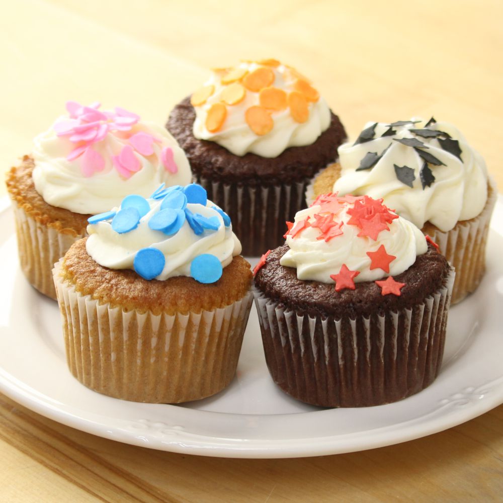 sprinkles on cupcakes made with royal icing and sprinkle stencils