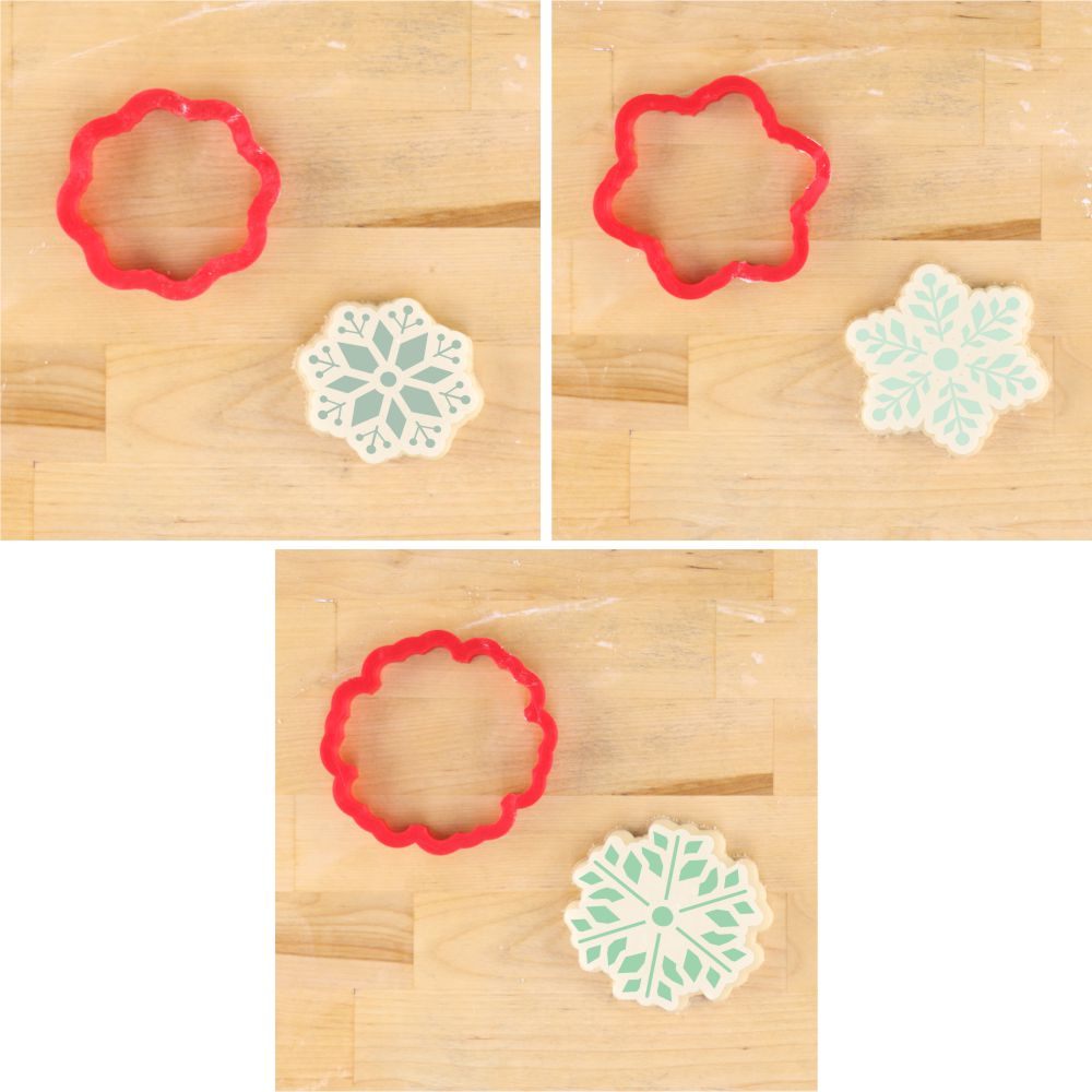 Snowflakes Holiday Project Box with red cookie cutters and decorated snowflake cookies on a wooden surface.