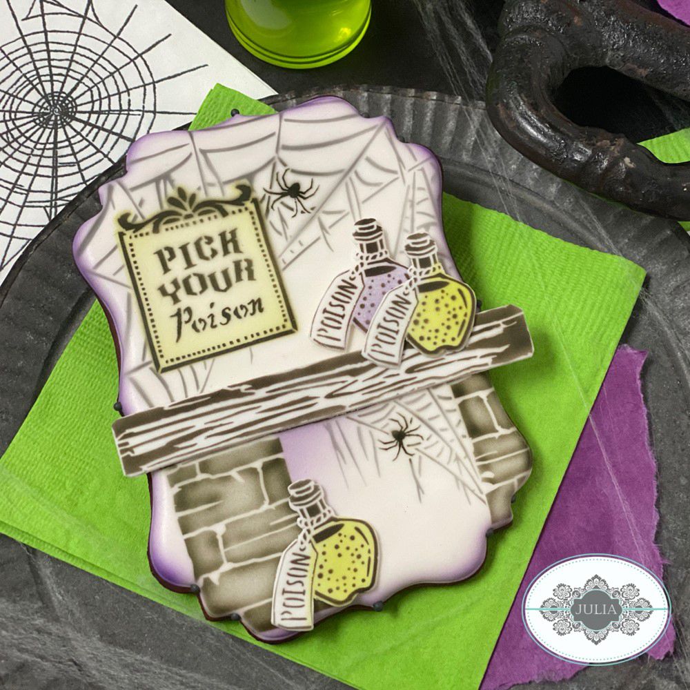 pick your poison message cookie stencil airbrushed on Halloween cookie by juila usher