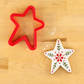Antique Style Star Cookie Cutter and a Folk Style Star-Shaped Cookie
