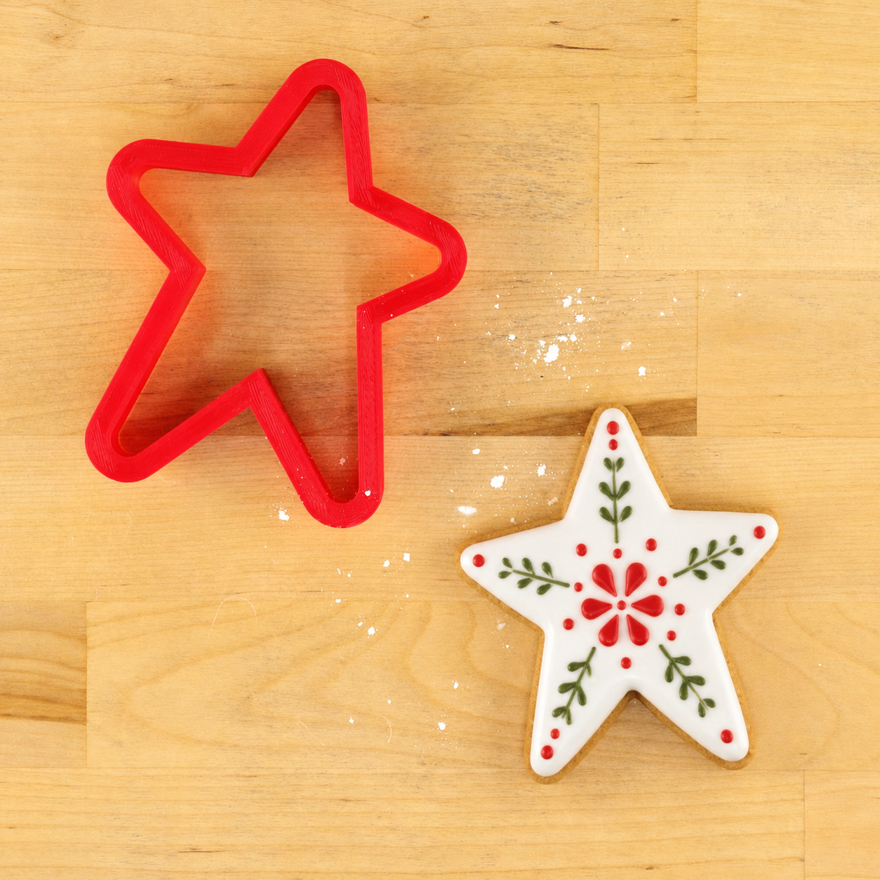 Antique Style Star Cookie Cutter and a Folk Style Star-Shaped Cookie