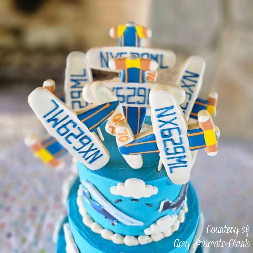 CAKE TOPPER MADE WITH COOKIES USING AIRPLANE COOKIE CUTTERS BY AMY SHUMATE CLARK