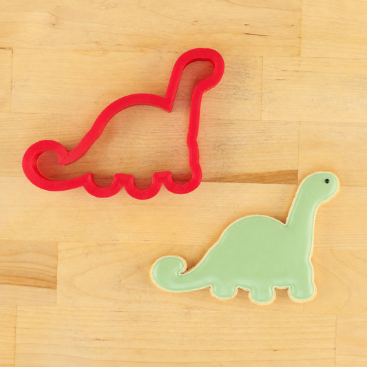Dinosaur cookie cutter and matching dinosaur-shaped cookie