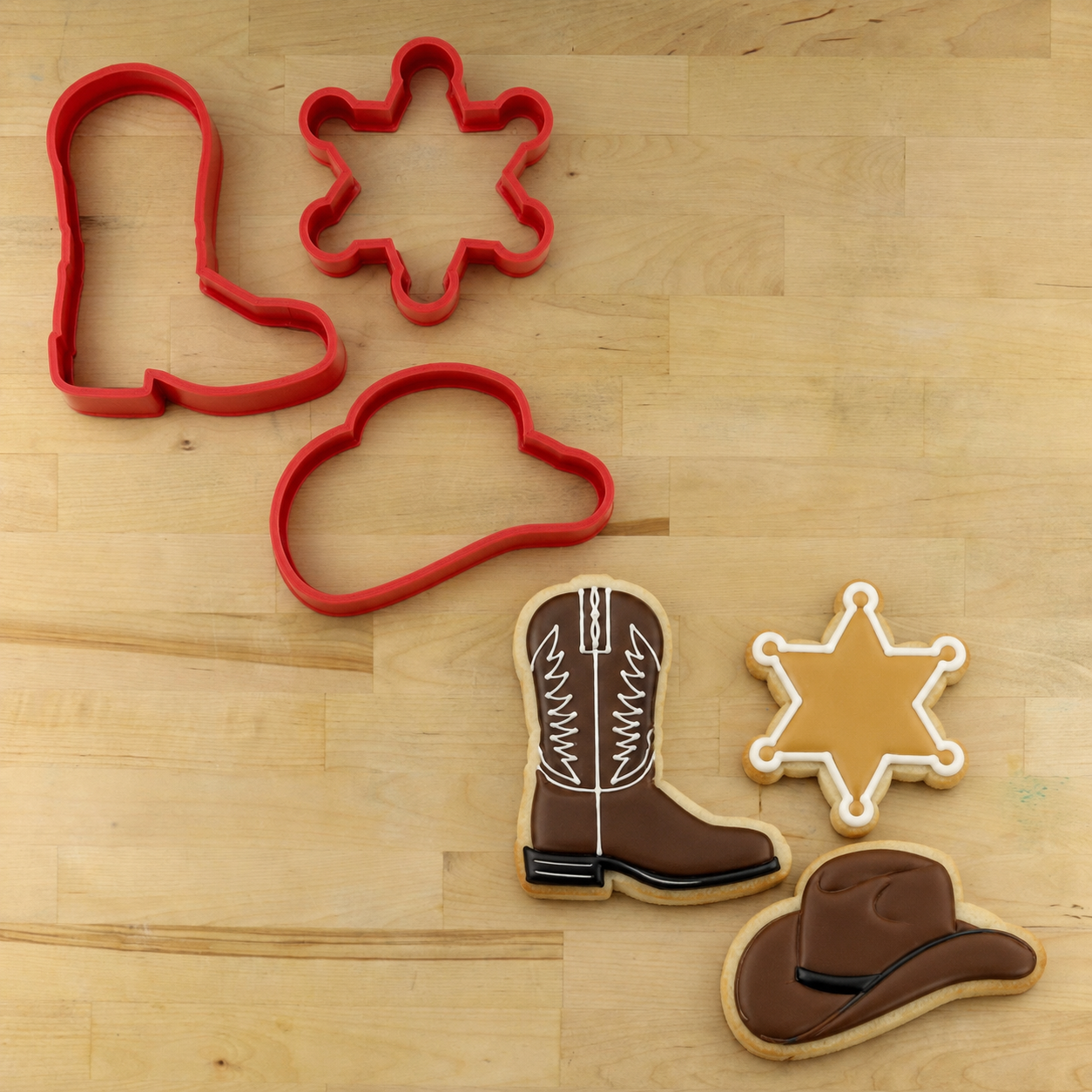 Cowboy Cookie Cutter Set featuring cowboy hat, cowboy boot, sheriff badge and horseshoe cookie cutters made from durable food-safe 3D printed plastic.