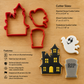 Three red plastic cookie cutters shaped like a haunted house, a ghost, and a tombstone are shown on a light wood background, alongside three decorated cookie cutouts and printed size/features information.
