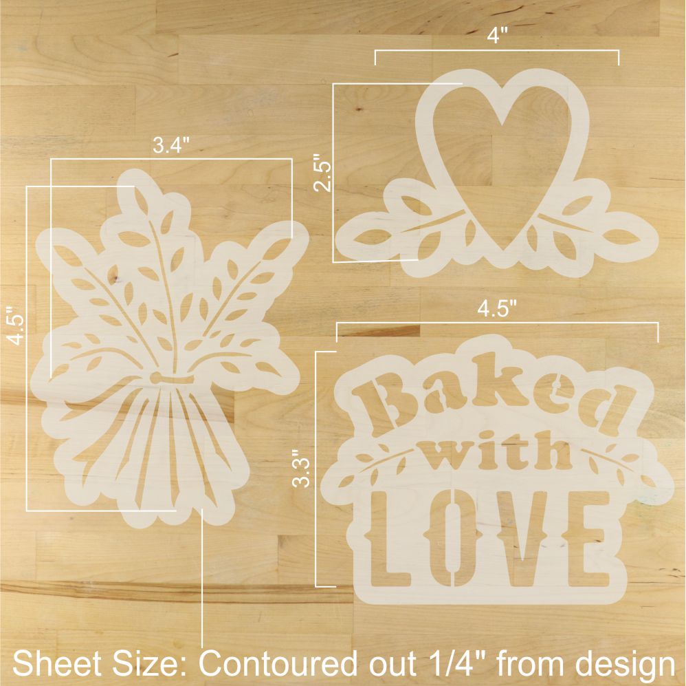 Three decorative stencils with measurements on a wooden surface