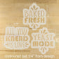 Three stencils with text 'BAKED FRESH', 'ALL YOU KNEAD IS LOVE', and 'YEAST MODE' on a wooden surface.