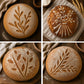 Flour dusted sourdough loaves using wheat stalk bread stencils